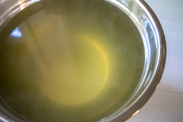 strained vegetable stock in mixing bowl