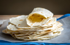 homemade flour tortillas one rolled up