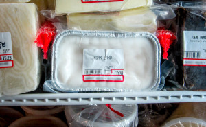 pork lard in butchers freezer blurred