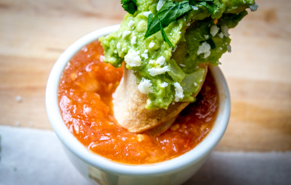 Dipping a crispy taquito into a bowl of homemade salsa can transport any dinner table straight to the heart of Mexico. Especially when using a warm Tomato Chipotle Salsa like this one. So good! mexicanplease.com
