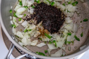 adding ancho to onion and jalapeno