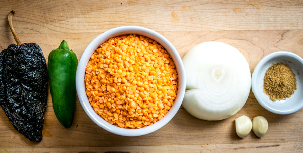 Got red lentils handy? This vegetarian Mexican lentil soup is super easy to make and only takes a small bite out of your wallet. mexicanplease.com