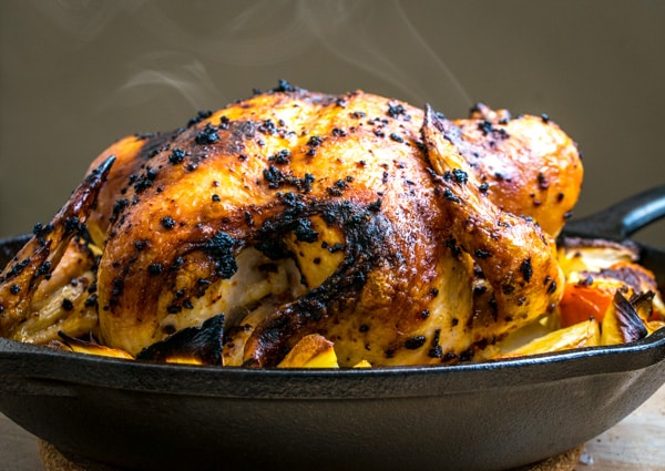 Mexican Roadside Chicken -- one pan, chili crusted, garlic infused roasted chicken that makes Mexico feel a little closer. So good! mexicanplease.com