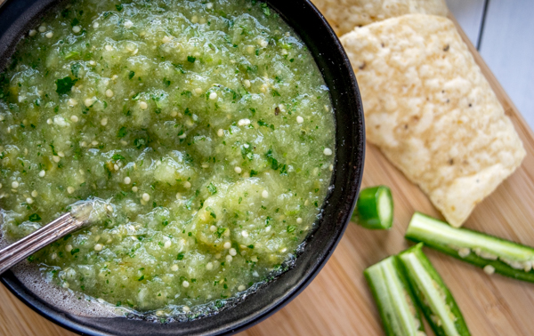 salsa verde with chip and serrano chili peppers