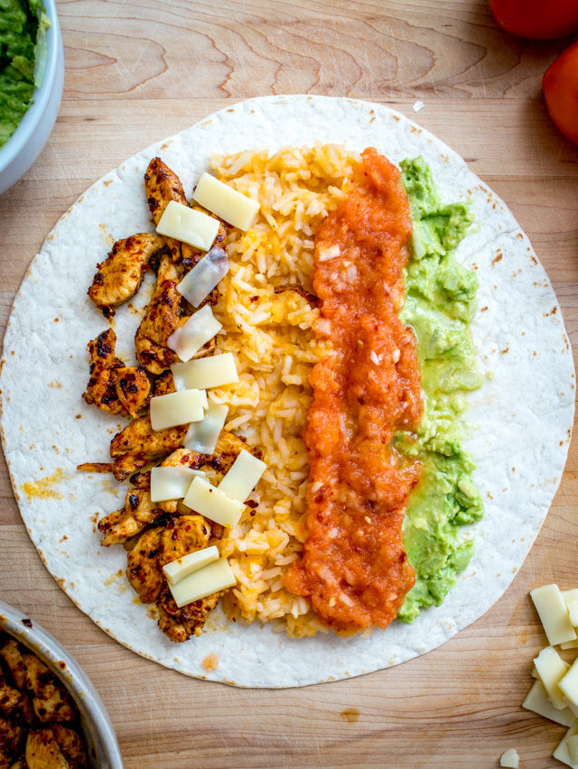 Homemade Tomato Chipotle Salsa gives this Chicken Guacamole Burrito a rich, full flavor. Don't forget to roast those tomatoes. So good! mexicanplease.com