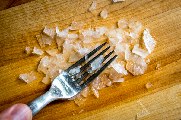 crushing onion for guacamole