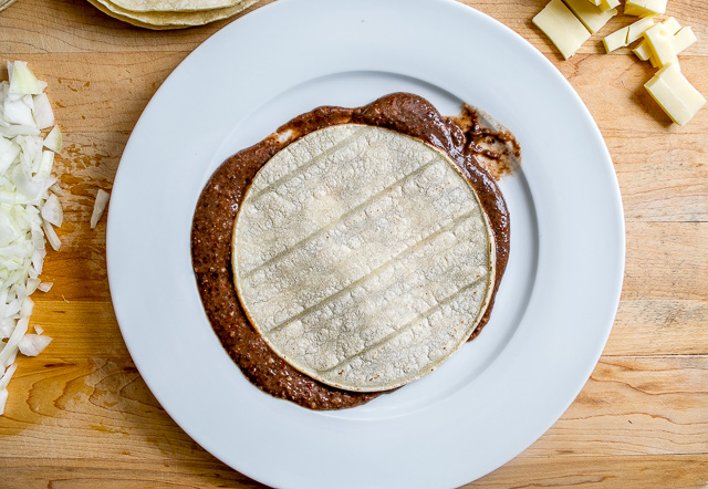 Corn tortillas drenched in a Chipotle infused Black Bean puree? I'm in! These Enfrijoladas have incredible flavor and can be customized to your liking. mexicanplease.com