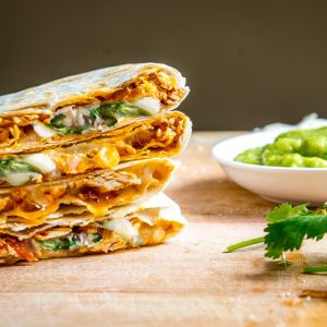 Got leftover Tinga? Make Tingadillas! These Cheesy Chicken Tinga Quesadillas with Green Sauce will change the course of your day for the better -- also includes recipe for making Tinga from scratch | mexicanplease.com