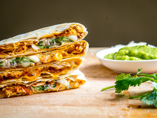 Got leftover Tinga? Make Tingadillas! These Cheesy Chicken Tinga Quesadillas with Green Sauce will change the course of your day for the better -- also includes recipe for making Tinga from scratch | mexicanplease.com