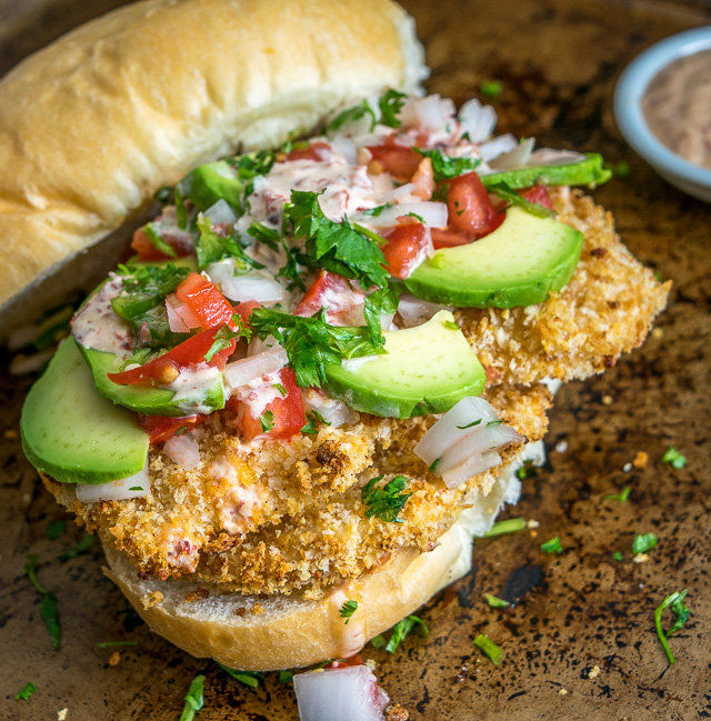 This Baked Milanesa Torta is loaded with avocado, Pico de Gallo and chipotle mayo. Yowsa! No frying either, just bread the chicken cutlets and give 'em 12 minutes in the oven. Buen Provecho. mexicanplease.com