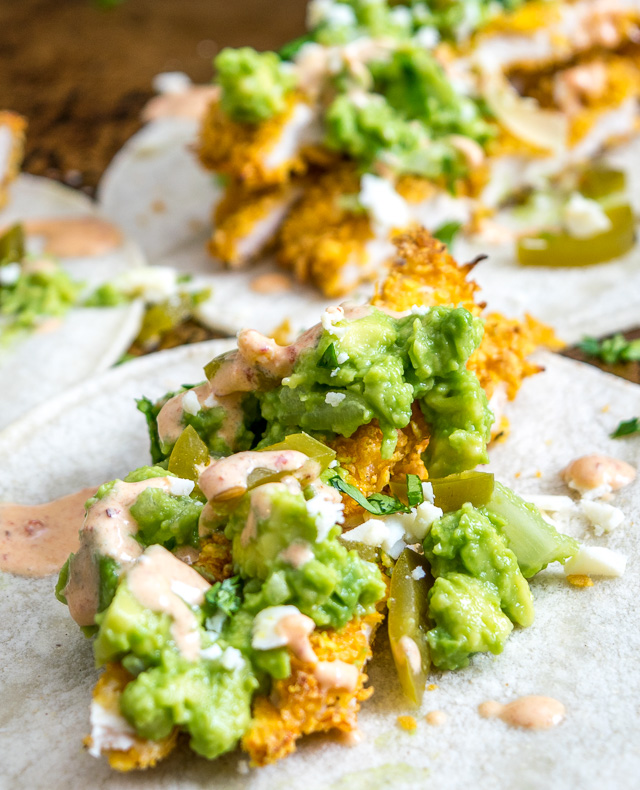 I've been eating these Crispy Chicken Tacos all week long -- crispy chicken strips, chipotle crema, guacamole, pickled jalapenos, Cotija cheese and cilantro -- all served on a warm corn tortilla. So good! mexicanplease.com