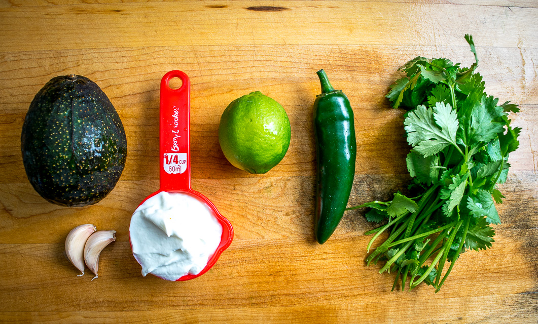 These Easy Burrito Bowls have a secret weapon that can instantly save your day: creamy avocado sauce with some zip from a jalapeno. So good! mexicanplease.com