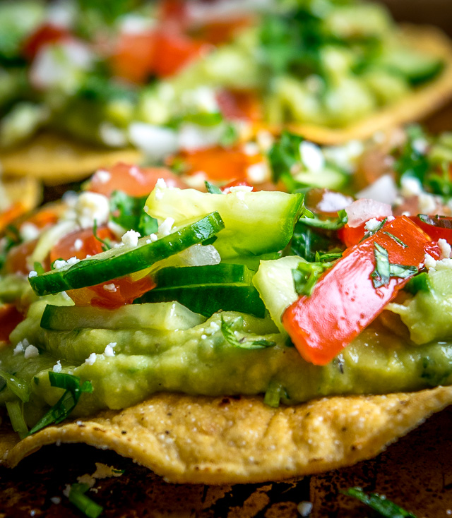 These Vegan Avocado Hummus and Cucumber Pico de Gallo Tostadas will make even the crankiest of carnivores take a second bite. Final zip from some hot sauce highly recommended. So good! mexicanplease.com