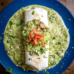 Think of this as the ultimate comfort food. A chicken guacamole burrito swimming in a creamy, goopy poblano sauce with otherworldly flavor. Don't forget to roast the poblano peppers. So good! mexicanplease.com
