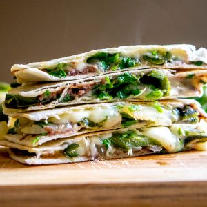 This Roasted Poblano Quesadilla recipe is a great example of the rich, otherworldly flavor that Mexican cuisine can generate by using just a few simple ingredients. And it's served with Avocado Salsa Verde! mexicanplease.com