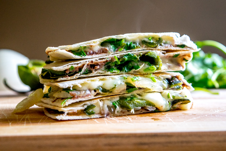 This Roasted Poblano Quesadilla recipe is a great example of the rich, otherworldly flavor that Mexican cuisine can generate by using just a few simple ingredients. And it's served with Avocado Salsa Verde! mexicanplease.com