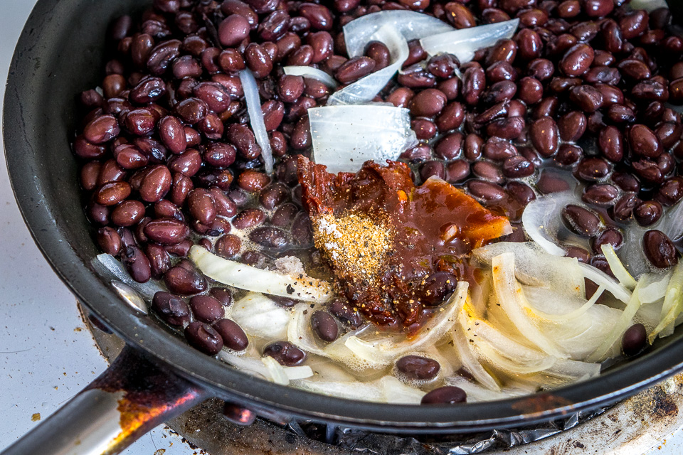 It's tough to beat the combo of warm tortilla chips, melted cheese, and spicy black beans. In other words, NACHOS!! These beans have some kick built into them from chipotles in adobo and they are beyond delicious. mexicanplease.com