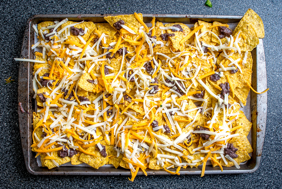 It's tough to beat the combo of warm tortilla chips, melted cheese, and spicy black beans. In other words, NACHOS!! These beans have some kick built into them from chipotles in adobo and they are beyond delicious. mexicanplease.com
