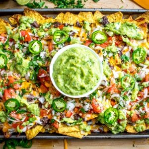 It's tough to beat the combo of warm tortilla chips, melted cheese, and spicy black beans. In other words, NACHOS!! These beans have some kick built into them from chipotles in adobo and they are beyond delicious. mexicanplease.com