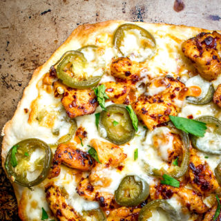 This Spicy Chicken and Pickled Jalapeno Pizza is the perfect example of Mexican cooking ingredients influencing just about everything in my kitchen. A super easy and delicious recipe with no special pizza gear needed! mexicanplease.com