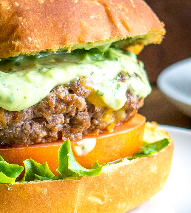 Spicing up your cheeseburgers with chipotles might convert you over for life. And when drenched in a creamy avocado sauce you just made the best burger in town. So good! mexicanplease.com