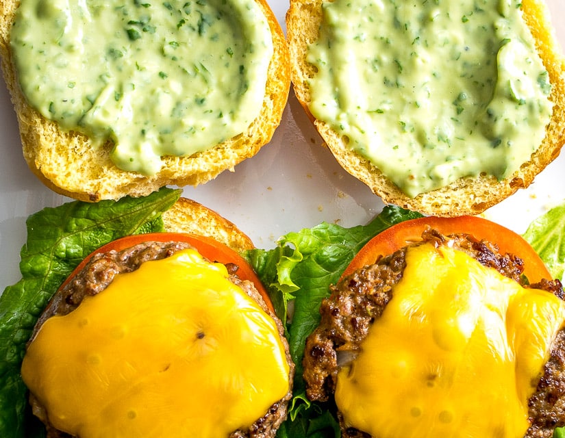 Spicing up your cheeseburgers with chipotles might convert you over for life. And when drenched in a creamy avocado sauce you just made the best burger in town. So good! mexicanplease.com