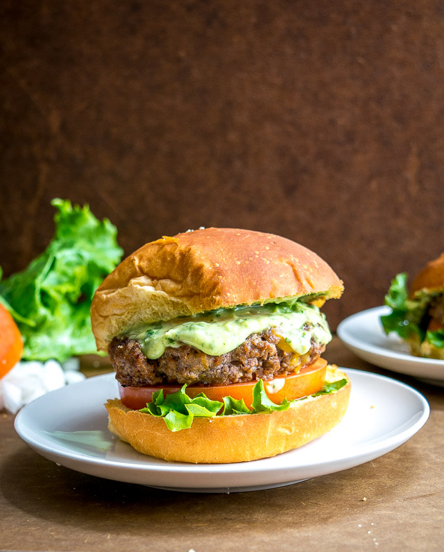 Spicing up your cheeseburgers with chipotles might convert you over for life. And when drenched in a creamy avocado sauce you just made the best burger in town. So good! mexicanplease.com