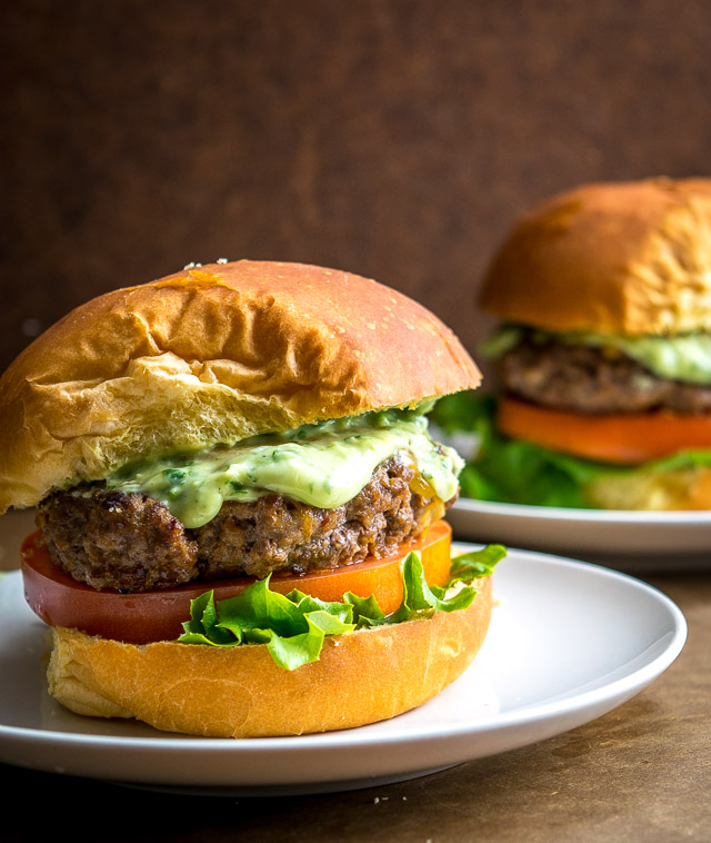 Spicing up your cheeseburgers with chipotles might convert you over for life. And when drenched in a creamy avocado sauce you just made the best burger in town. So good! mexicanplease.com