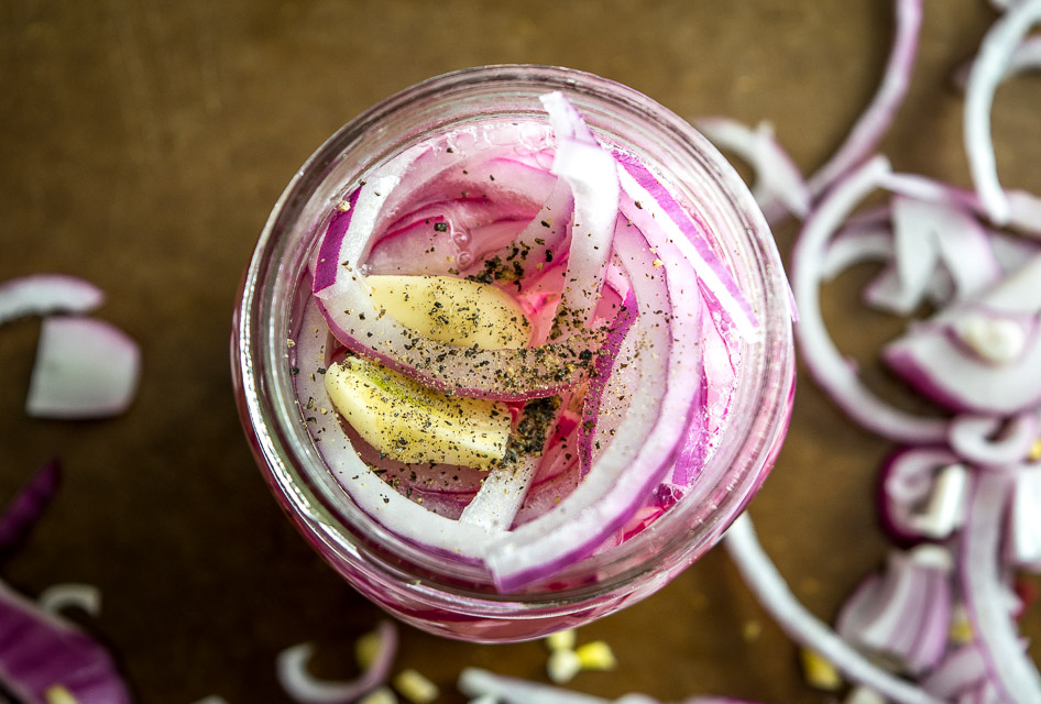 Here's an easy recipe for a quick batch of delightful pickled onions. You can use these on sandwiches, tacos, tostadas, or anything that needs a final dash of zip to liven it up. So good! mexicanplease.com