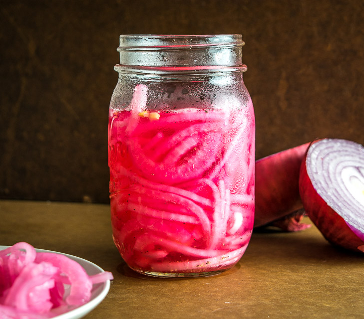 Here's an easy recipe for a quick batch of delightful pickled onions. You can use these on sandwiches, tacos, tostadas, or anything that needs a final dash of zip to liven it up. So good! mexicanplease.com