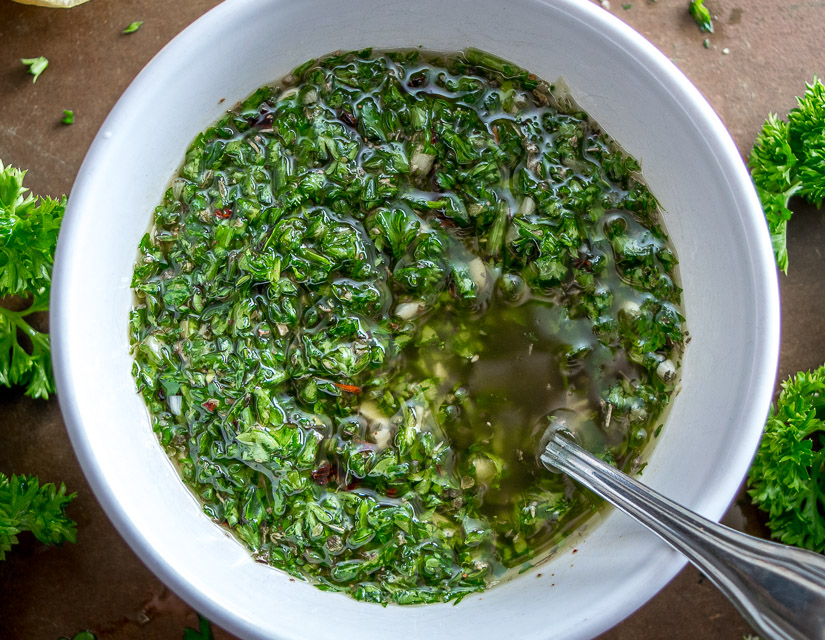 I'm using chili powder and cayenne to give a traditional chimichurri sauce some real kick! This version really shines when served with some homemade empanadas. So good! mexicanplease.com