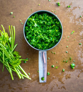 I'm using chili powder and cayenne to give a traditional chimichurri sauce some real kick! This version really shines when served with some homemade empanadas. So good! mexicanplease.com