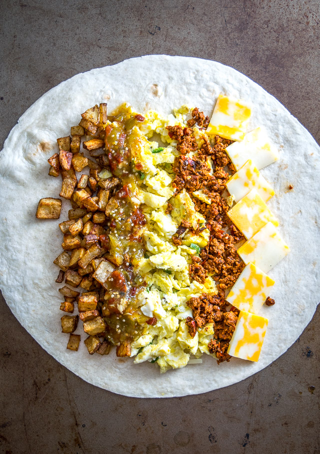 It would be easy to give all the credit to the chorizo in these epic breakfast burritos. But it's the tomatillo salsa that really amps them up. So good! mexicanplease.com