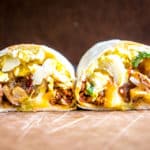 It would be easy to give all the credit to the chorizo in these epic breakfast burritos. But it's the tomatillo salsa that really amps them up. So good! mexicanplease.com