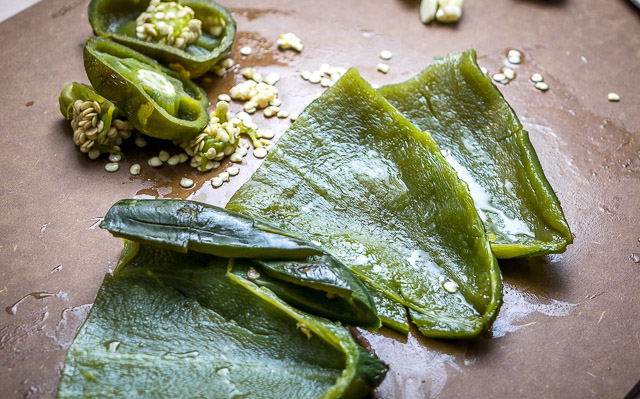 Here's a recipe for a vibrant homemade green chorizo that uses poblanos and serranos to really spice things up. It's surprisingly easy to make too! mexicanplease.com