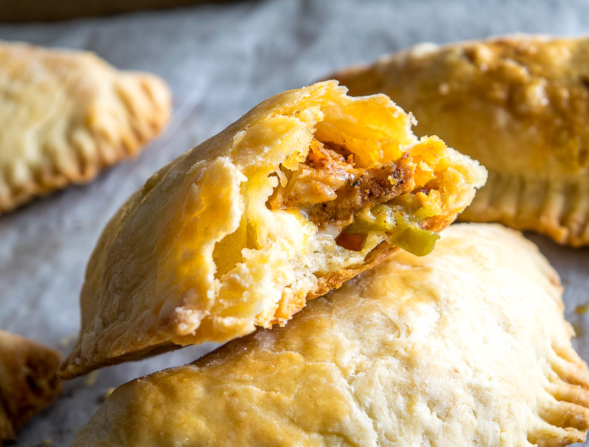 Here's a great combo to consider for your next batch of homemade empanadas: spicy chicken and pickled jalapenos. Don't forget to chill the dough before rolling it out as this will keep them light and flaky. So good! mexicanplease.com