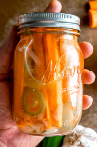 These Mexican Pickled Carrot Sticks want to be in your life! Crispy, delicious, and full of zip from the jalapeno. Super easy to make too. mexicanplease.com