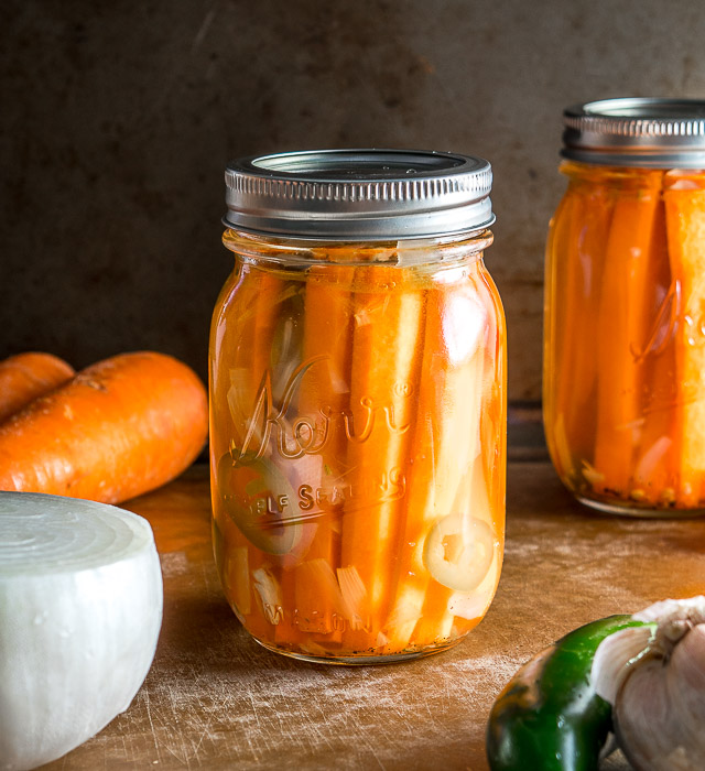 These Mexican Pickled Carrot Sticks want to be in your life! Crispy, delicious, and full of zip from the jalapeno. Super easy to make too. mexicanplease.com