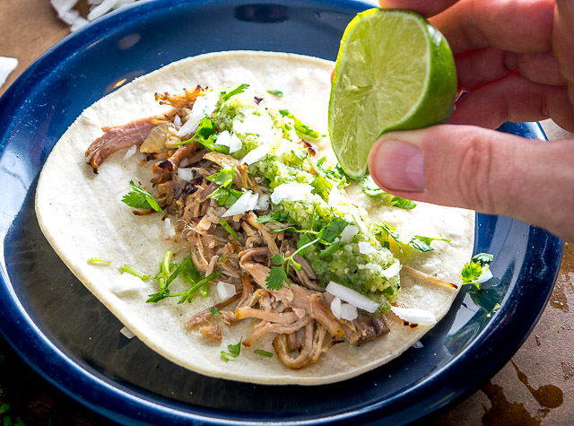 One of my all-time favorite recipes! The slow cooker keeps these carnitas moist and loads them up with flavor. Best combo for tacos is carnitas, salsa verde, onion, cilantro and a squeeze of lime. So good! mexicanplease.com