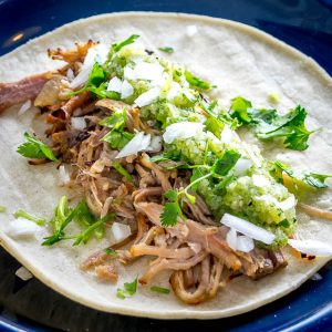 One of my all-time favorite recipes! The slow cooker keeps these carnitas moist and loads them up with flavor. Best combo for tacos is carnitas, salsa verde, onion, cilantro and a squeeze of lime. So good! mexicanplease.com