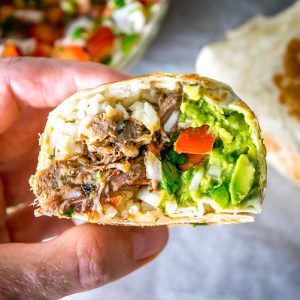 Freshly made Pico de Gallo combines with Barbacoa Beef and Guacamole to make these burritos sing! Slow cooker barbacoa works great but feel free to use any shredded beef you have on hand. So good! mexicanplease.com