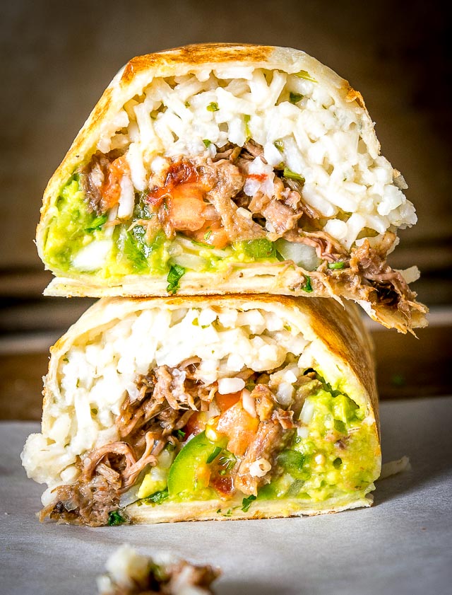 Freshly made Pico de Gallo combines with Barbacoa Beef and Guacamole to make these Barbacoa Beef Burritos sing! Slow cooker barbacoa works great but feel free to use any shredded beef you have on hand. So good! mexicanplease.com