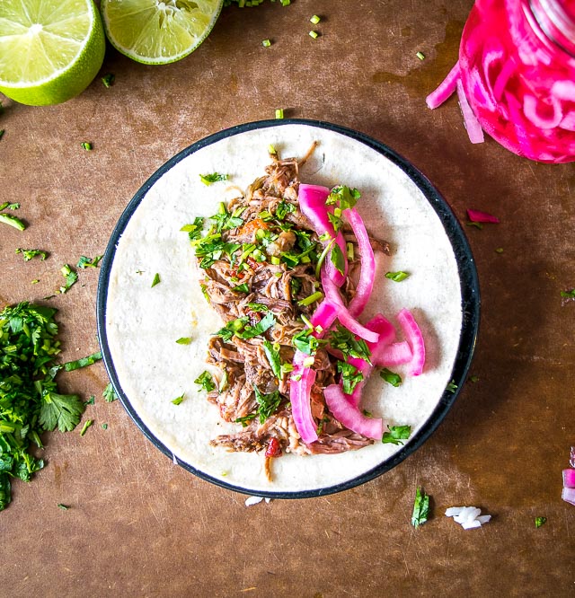 This stress-free slow cooker barbacoa can be used in so many delicious ways: tacos, burritos, enchiladas -- you can even serve it over rice for an instant meal. So good! mexicanplease.com