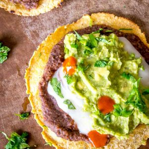 Serious reward to effort ratio here! We're crisping a corn tortilla and loading it up with spicy black bean puree and a refreshing guacamole. So good! mexicanplease.com