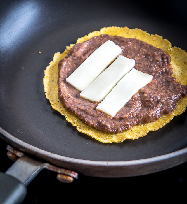 Serious reward to effort ratio here! We're crisping a corn tortilla and loading it up with spicy black bean puree and a refreshing guacamole. So good! mexicanplease.com