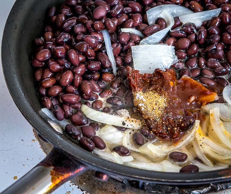 Serious reward to effort ratio here! We're crisping a corn tortilla and loading it up with spicy black bean puree and a refreshing guacamole. So good! mexicanplease.com