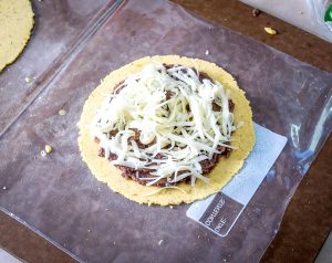 Two crispy corn tortillas surround a pocket full of spicy black beans and mozzarella cheese. Be sure to use a bit of oil when cooking them, this will help them crisp up. mexicanplease.com