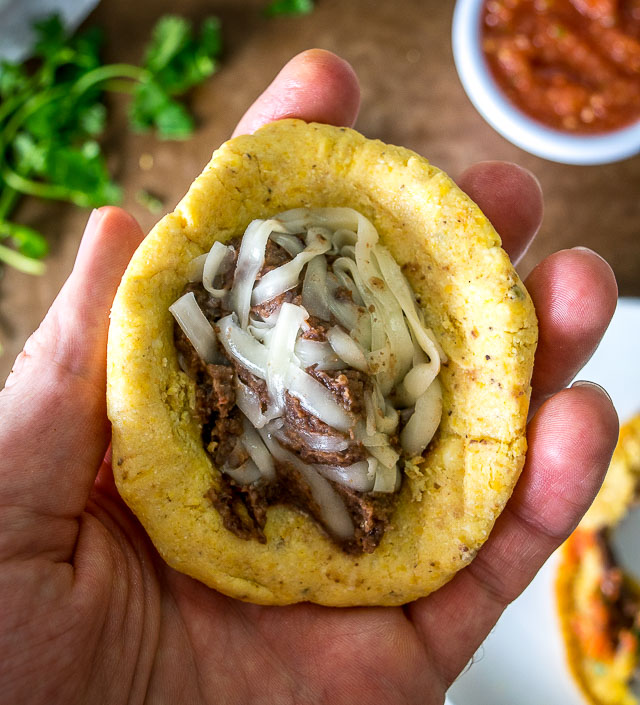 Two crispy corn tortillas surround a pocket full of spicy black beans and mozzarella cheese. Be sure to use a bit of oil when cooking them, this will help them crisp up. mexicanplease.com