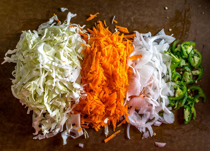 Curtido is a lightly fermented cabbage slaw common in Central America. Using a jalapeno gives it some real zip but you can always dial back on it if you want. mexicanplease.com