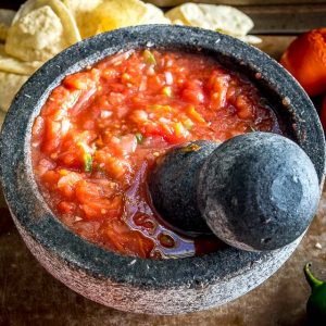 You might be surprised the first time you try salsa made in a molcajete. Crushing the veggies releases additional oils and creates an explosion of flavor that traditional salsas don't have. So good! mexicanplease.com